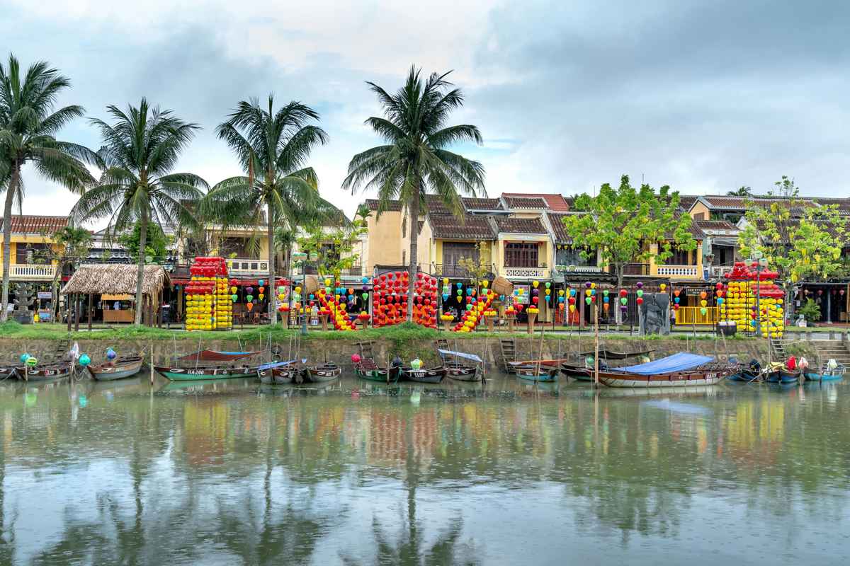 Hoi An Ancient Town Vietnam at night with colorful lanterns reflecting on river, family vacation destination