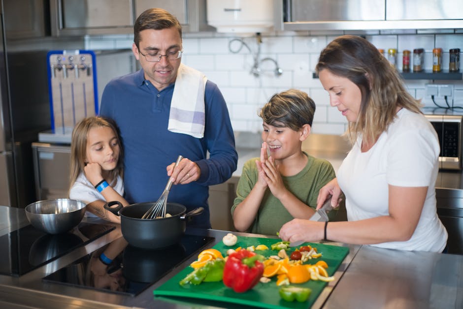 Family preparing meals together in a vacation rental kitchen to save on food costs