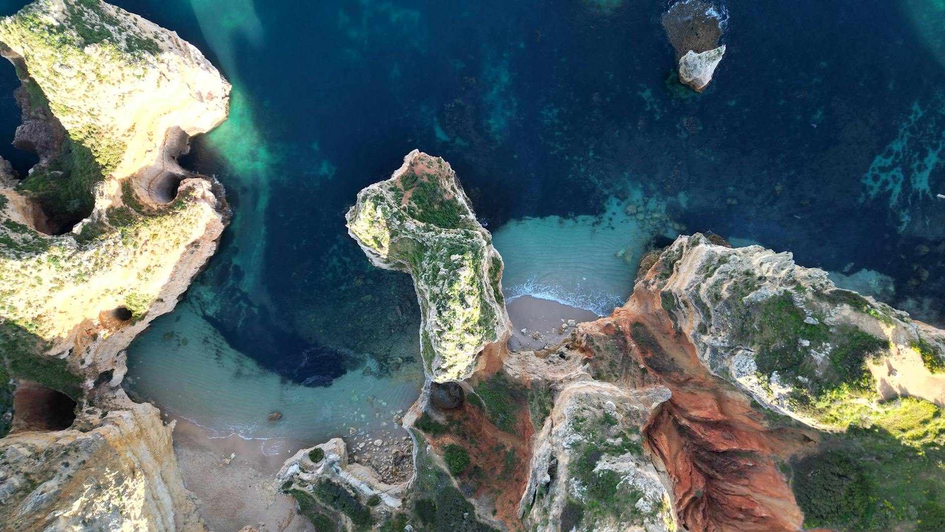 Aerial view of Algarve cliffs and beach, a central Algarve family holidays scene