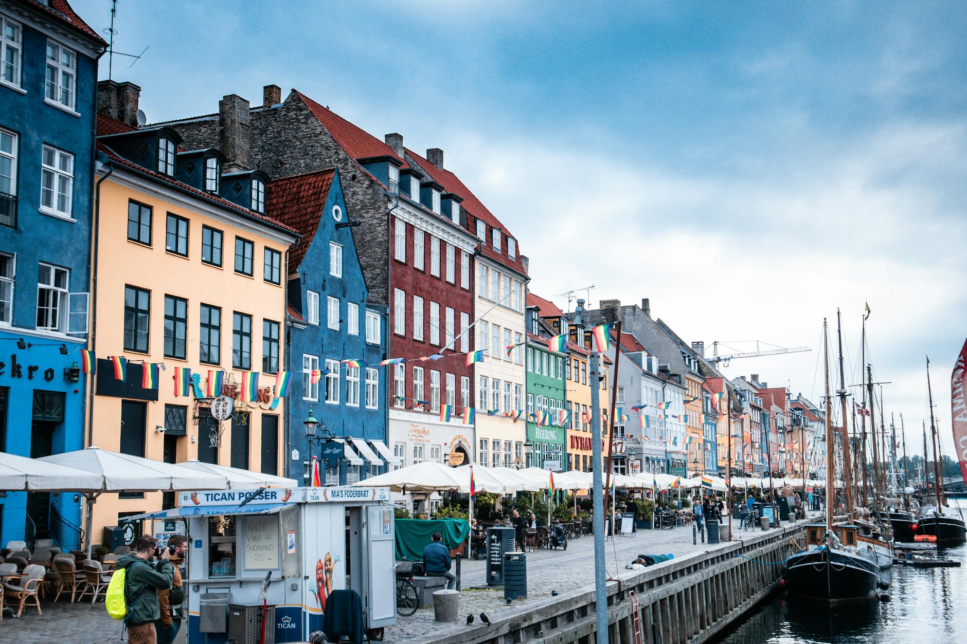 Copenhagen's Nyhavn harbor with painted townhouses and wooden boats &mdash; family walking route from the city center.