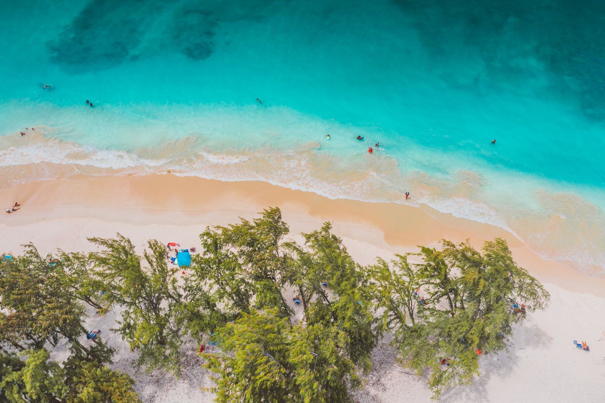 Turquoise Bahamas water and white sand of the kind surrounding Paradise Island's beaches