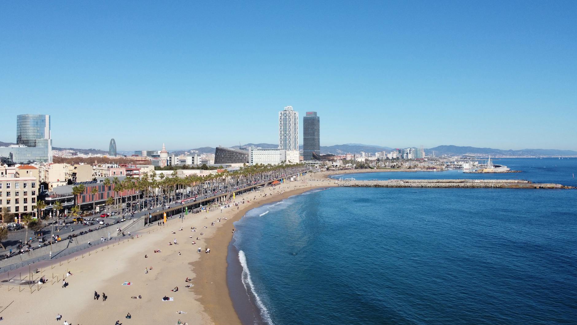 Aerial view of Barcelona beach and city skyline along the Mediterranean coast