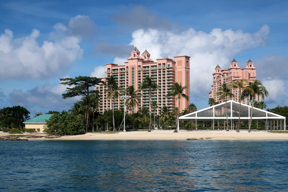 A Caribbean beachfront resort seen from the water, the kind of property these tier comparisons are built around.