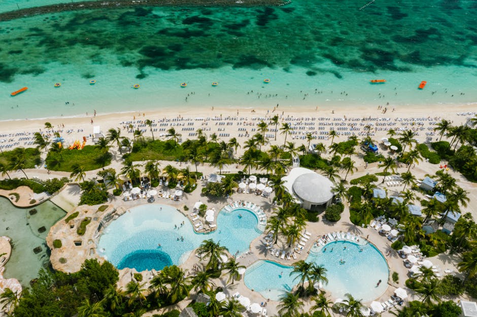 A Caribbean all-inclusive resort beach set up for families, the kind of stay the totals in Table 1 buy