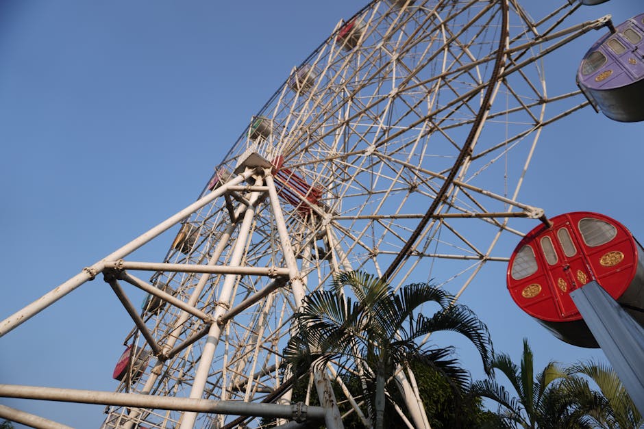 Colorful ferris wheel at a family theme park on a clear day