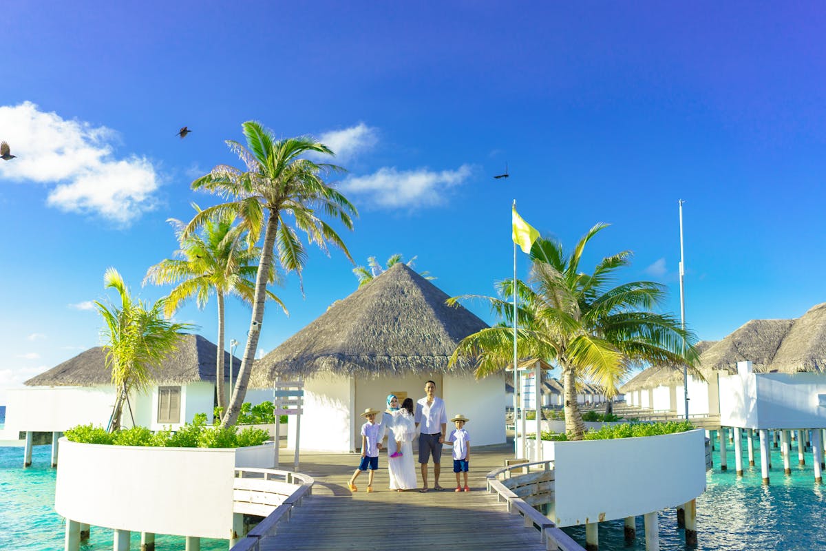 Tropical beach scene with palm trees and clear blue water
