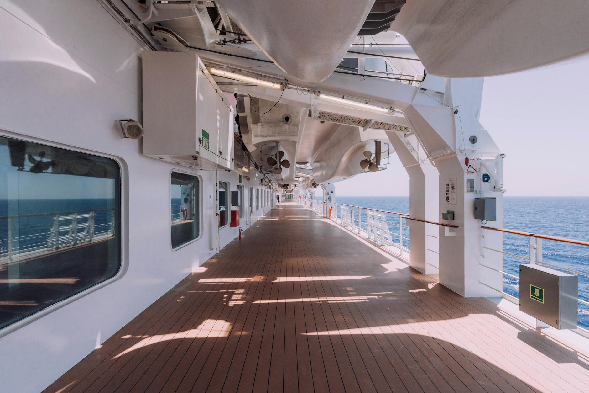 Open cruise ship deck overlooking the ocean on a clear sunny day