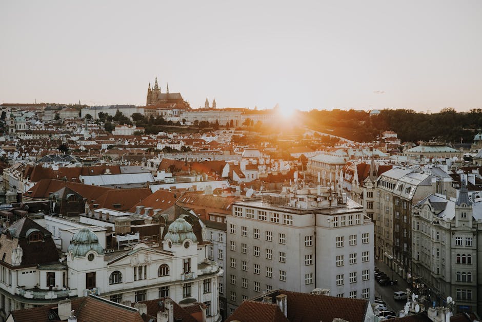 Sunset panorama over Prague skyline showing historic spires and rooftops