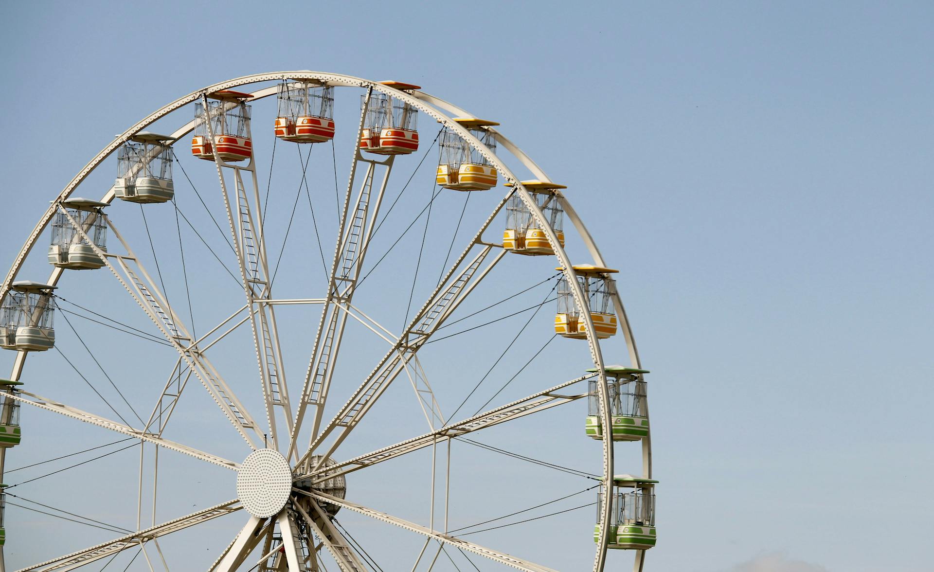 Colorful ferris wheel and rides at a family theme park