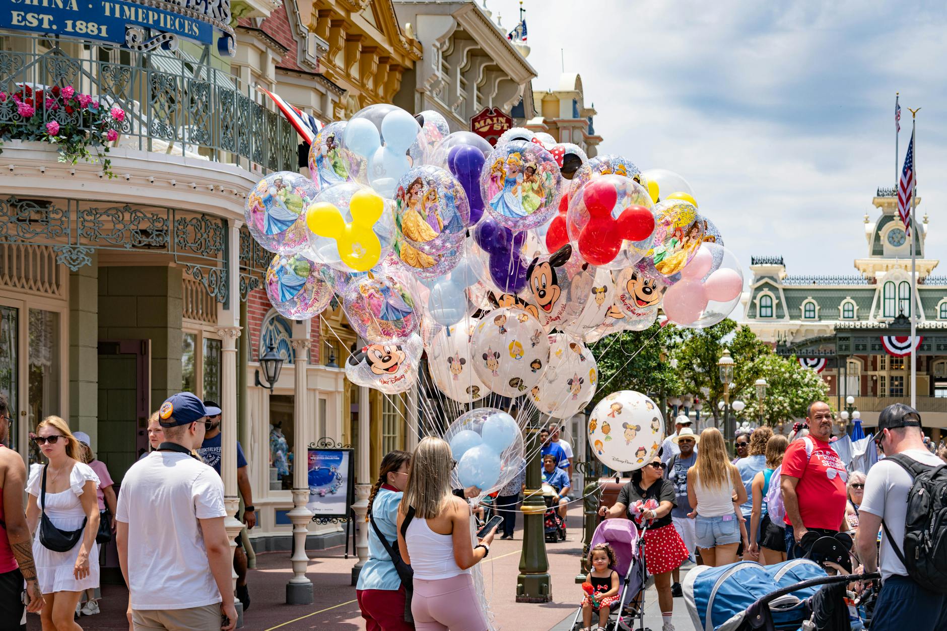 Colorful Disney character balloons floating on Main Street USA at Magic Kingdom