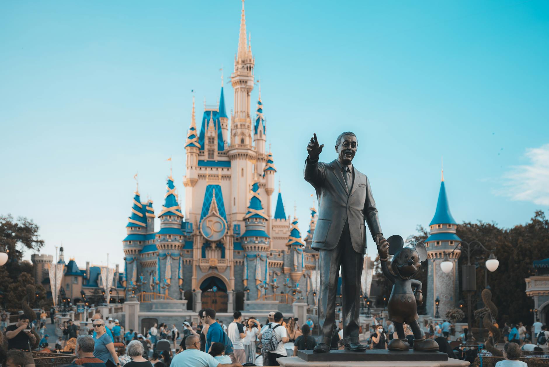 Families walking near Cinderella Castle at Walt Disney World in Orlando Florida