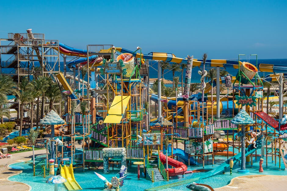 Water park with colorful slides, pools, and palm trees on a sunny family outing
