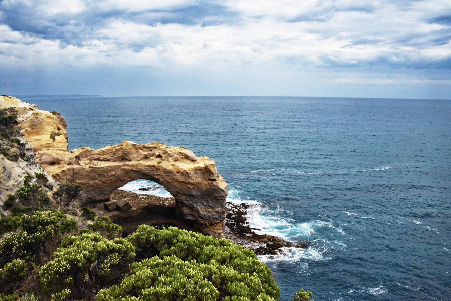 Rocky ocean arch formation along the Cabo San Lucas coastline with dramatic waves