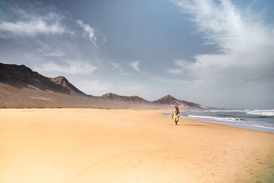 Fuerteventura golden sand beach and dunes with Atlantic surf for Canary Islands family holiday