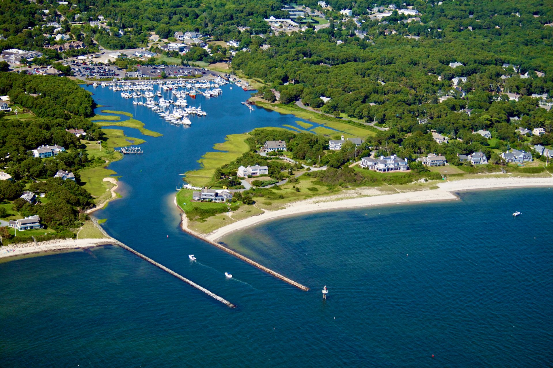 Aerial view of Harwich Harbor on Cape Cod with boats moored along its jetties