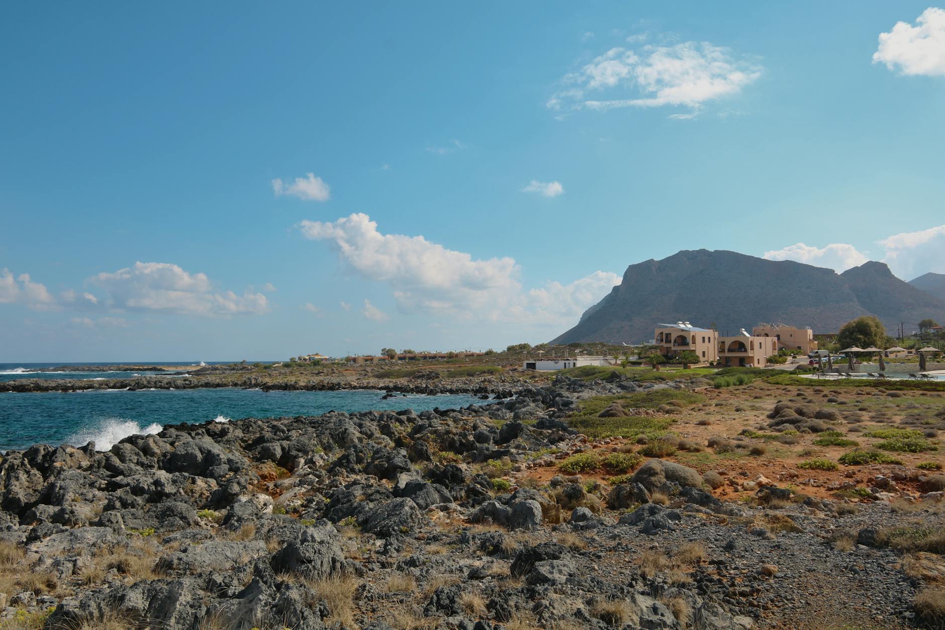 Chania rocky coastline with clear blue sky, a western Crete family holiday base