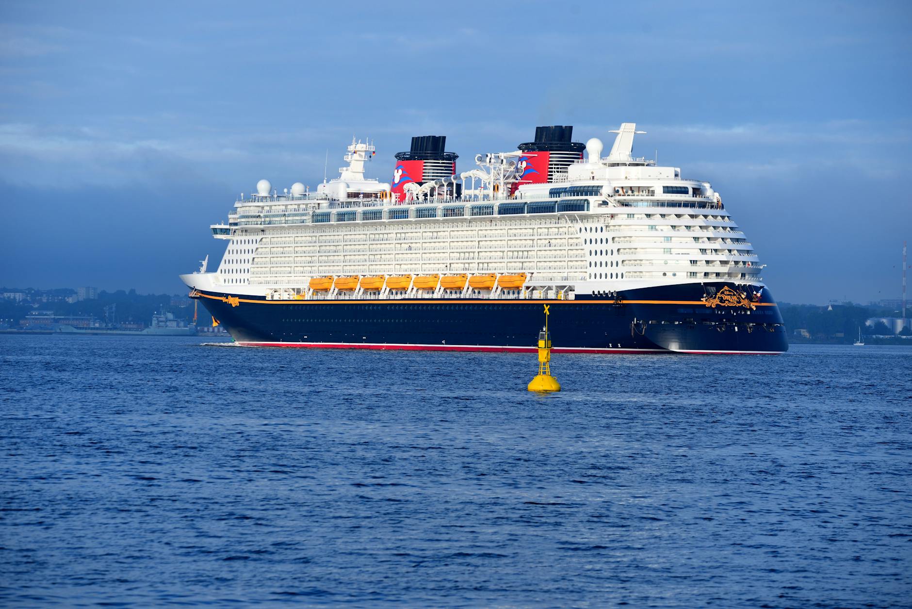 Disney Cruise Line ship sailing in open ocean for the Disney Cruise vs Disney World first-timer comparison