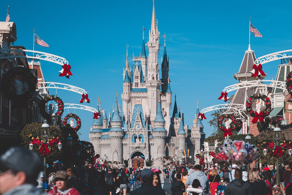 Disney World Magic Kingdom castle with crowds on a sunny day