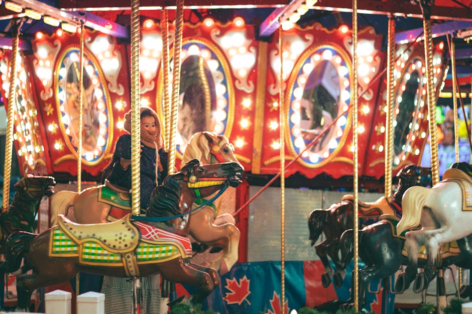 Kids enjoying a colorful carousel ride at an amusement park