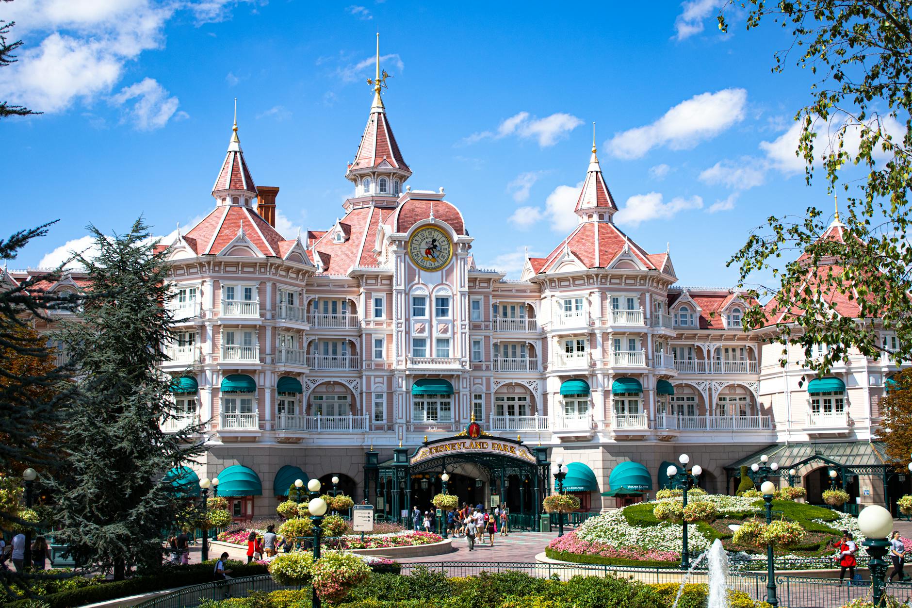 The Disneyland Hotel entrance at Disneyland Paris on a clear day &mdash; the on-site flagship that anchors the premium-tier family stay