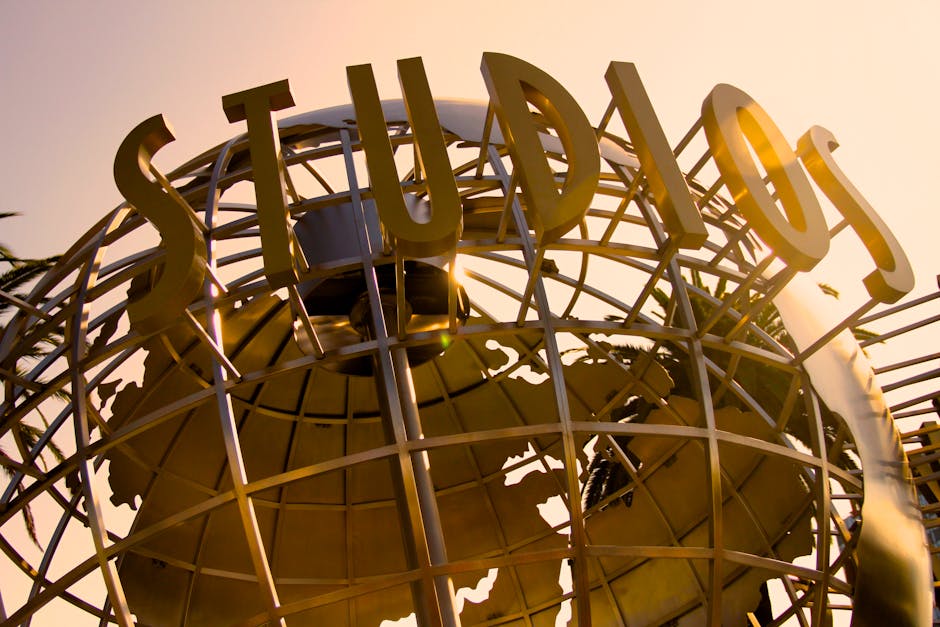 Universal Studios Hollywood globe sculpture at sunset with golden light