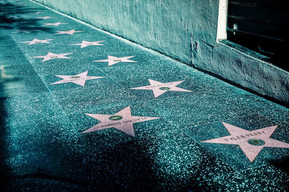 Walk of Fame stars on a sidewalk in Hollywood near Universal Studios area