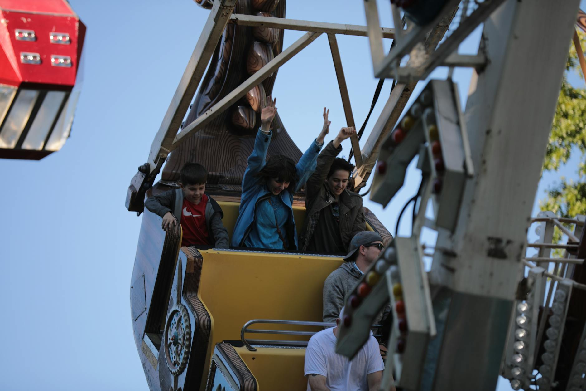 Family enjoying a theme park ride at a kid-friendly vacation destination