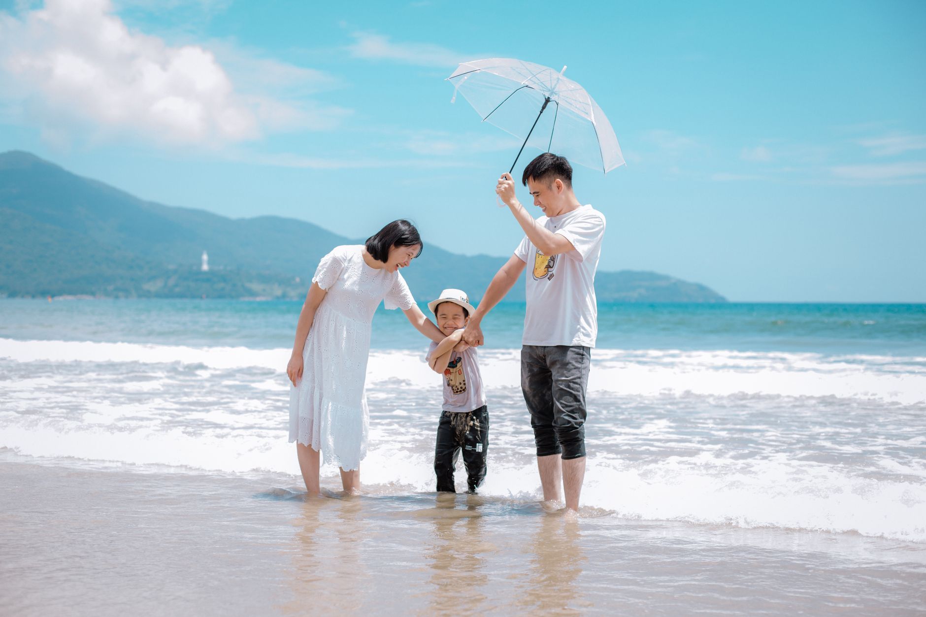 Family enjoying a sunny beach day on an extended vacation showing why longer trip lengths pay off when activity intensity is self-paced