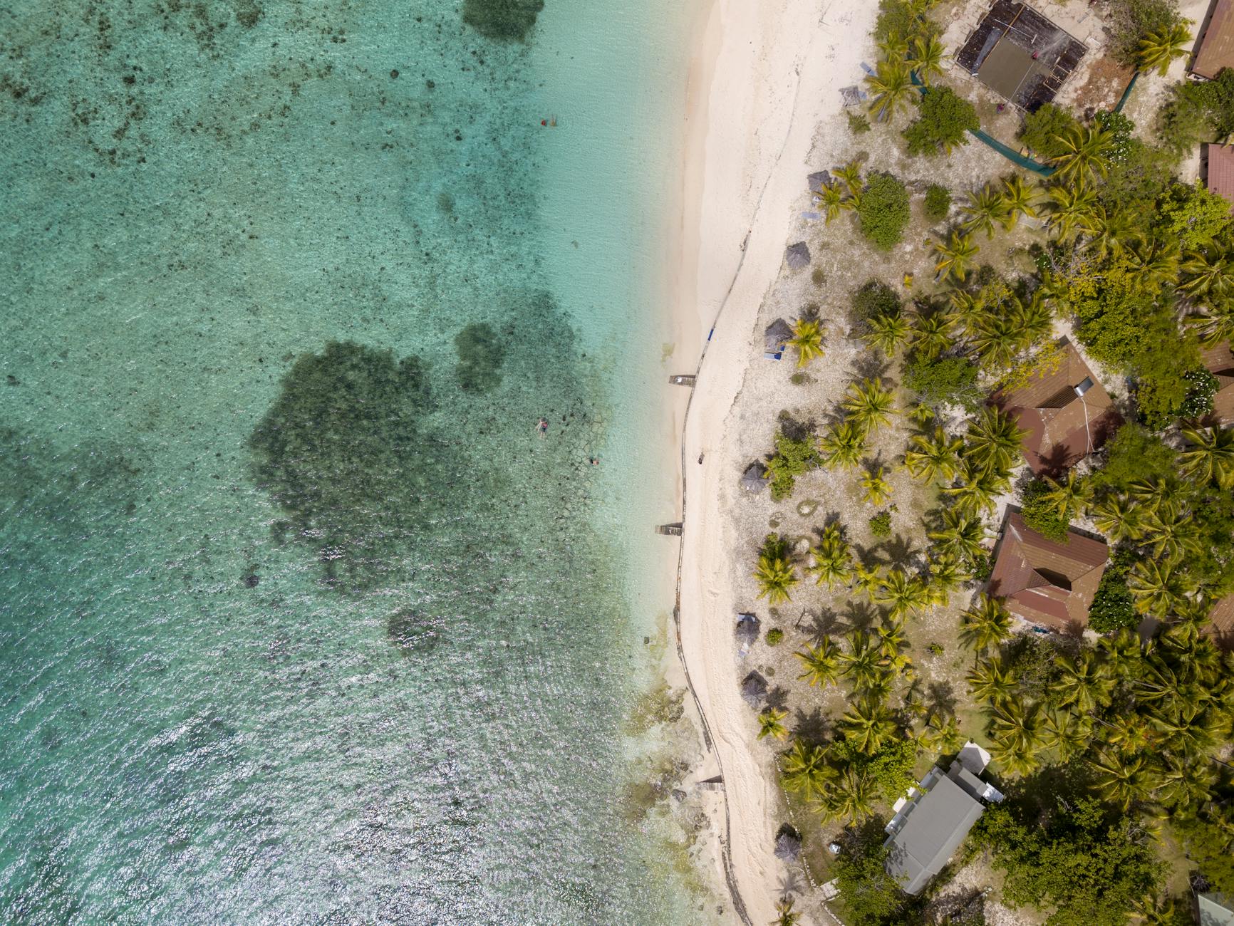Aerial view of a Mamanuca Islands resort with turquoise lagoon, a Fiji family resorts highlight