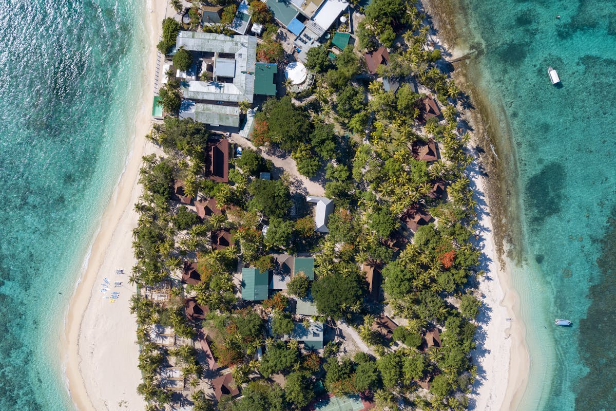 Fiji resort beach with turquoise lagoon water and tropical palm trees