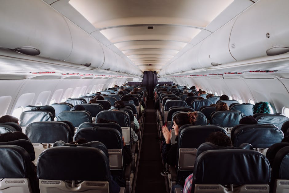 Passengers seated inside a commercial airplane cabin during a family flight