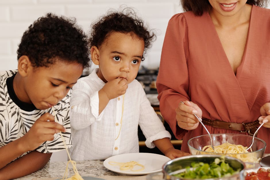 Children eating a safe home-prepared meal at the kitchen table