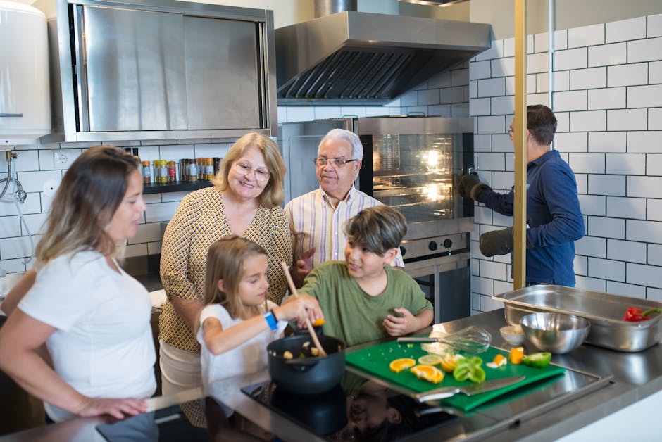Family preparing food together in a kitchen during a vacation stay