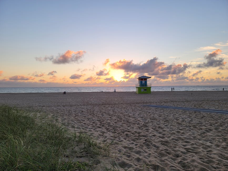 Fort Lauderdale Beach sunrise with lifeguard tower and golden sand