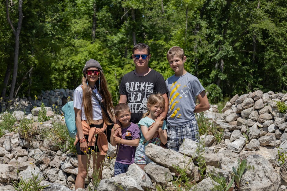 Family of five enjoying an outdoor adventure together on a sunny day