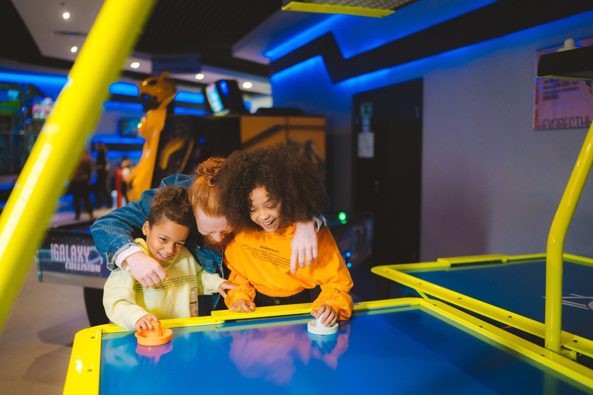 Family playing arcade games together, the paid extras that lift a Great Wolf Lodge weekend above the room rate