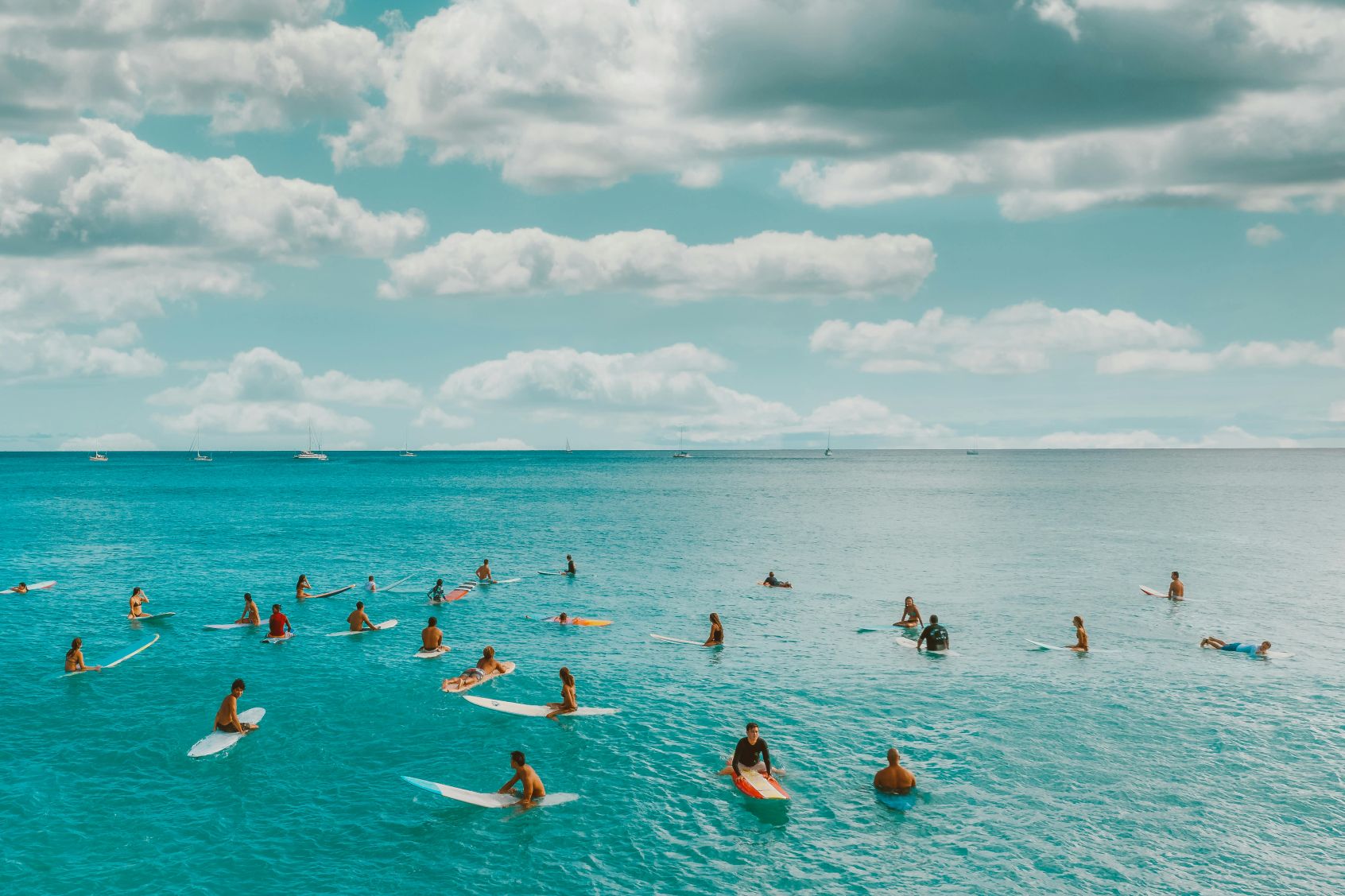 Couple reviewing vacation finances with calculator - planning family trip budget