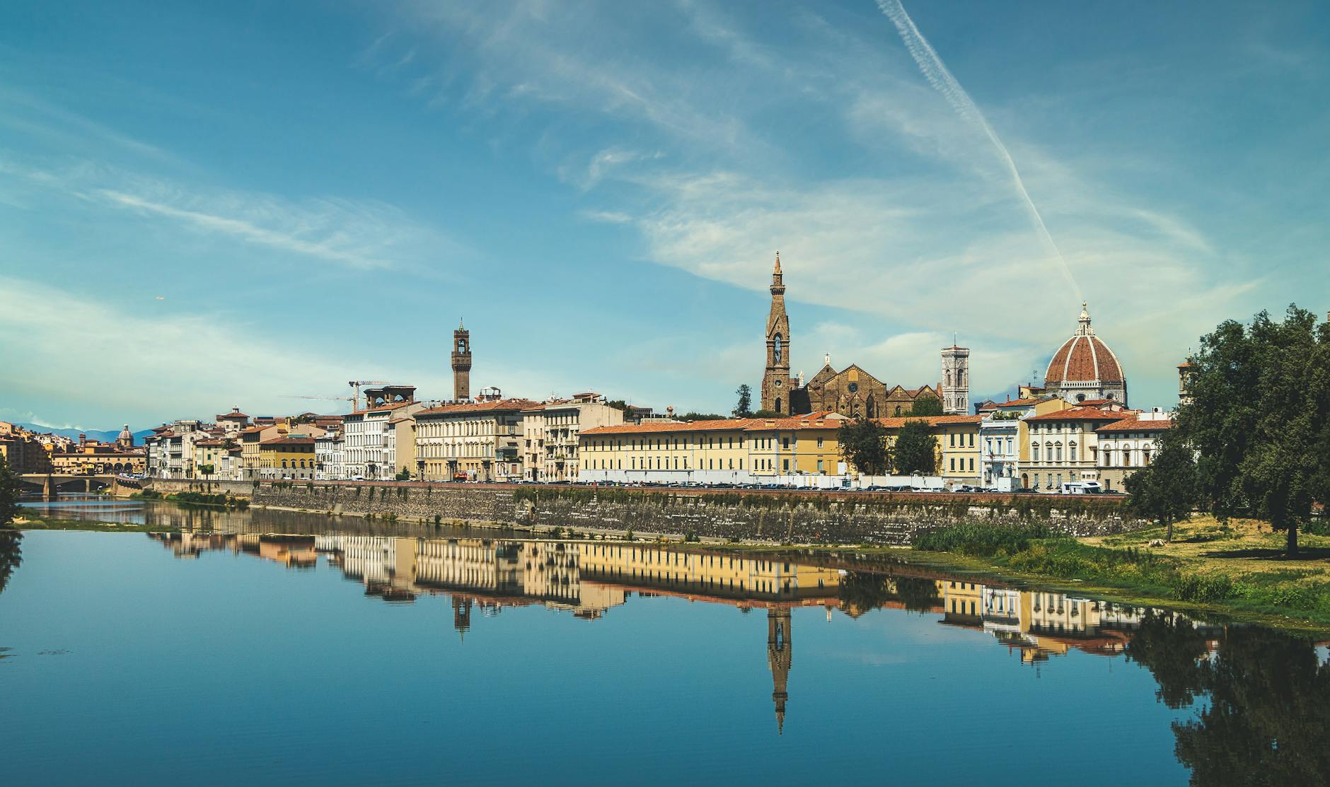 Florence skyline with Duomo and Arno river reflection, a highlight of a 10-day Italy family itinerary