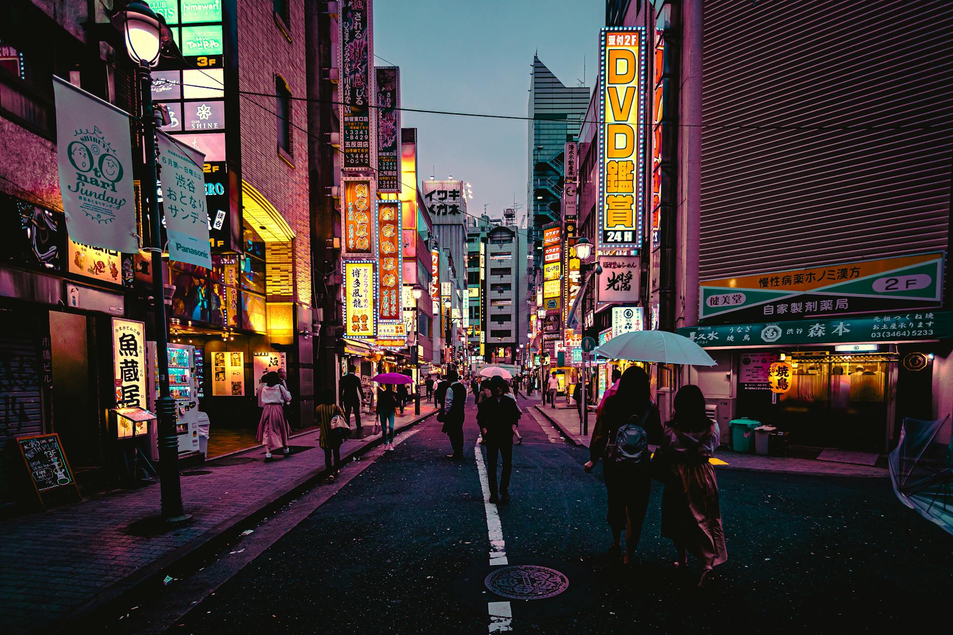 Tokyo neon-lit street at night showing Japan urban family travel experience