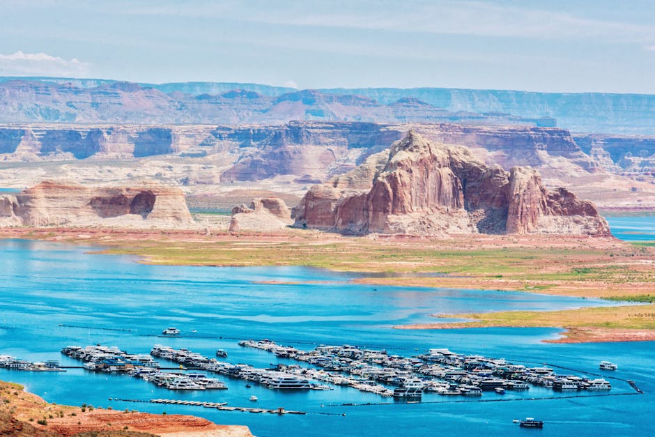 Sunset over Lake Powell sandstone cliffs and still water