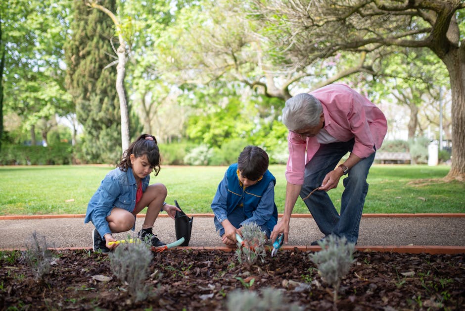 Grandfather gardening with grandchildren during a multigenerational family trip