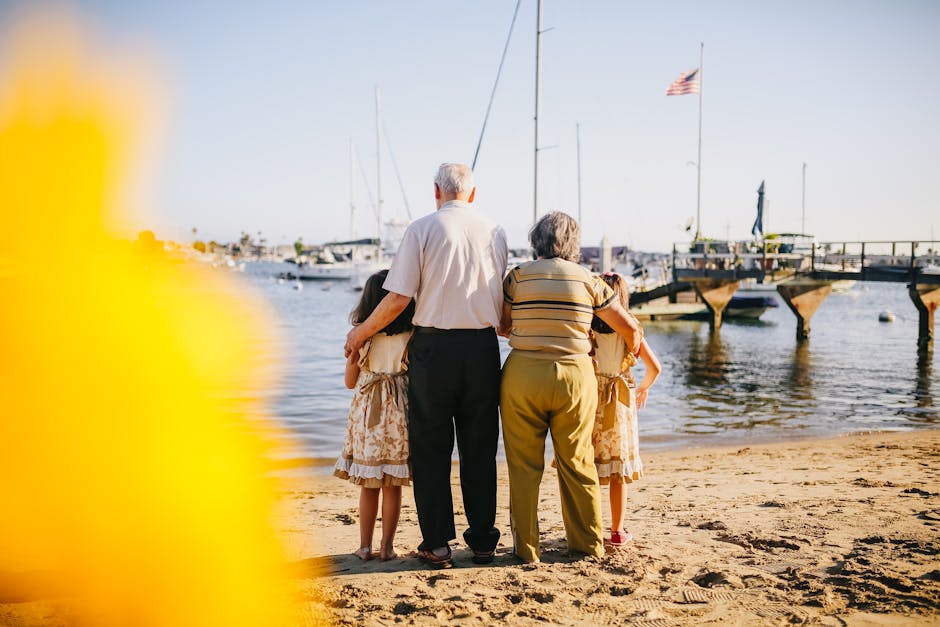 Grandparents and grandchildren enjoying a sunny day at the beach together