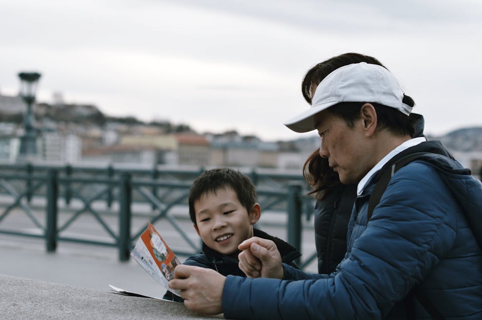 Family exploring a city together while looking at a map during a sightseeing day