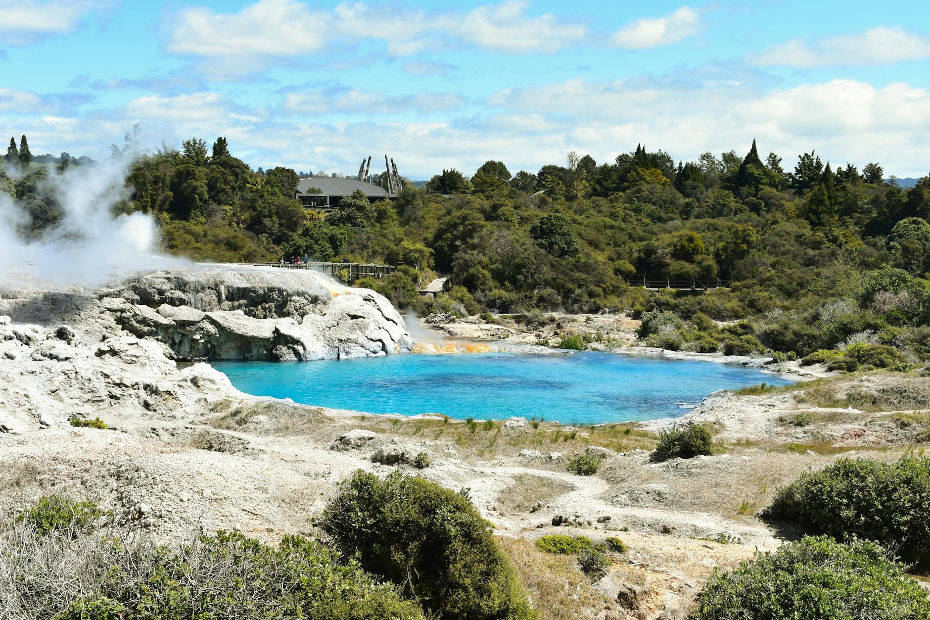 South Island New Zealand turquoise lake surrounded by mountains for family road trip