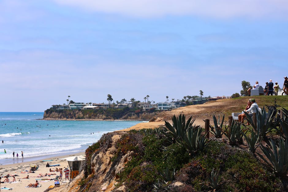 Beautiful coastal scene with cliffs and beachgoers along the San Diego shoreline