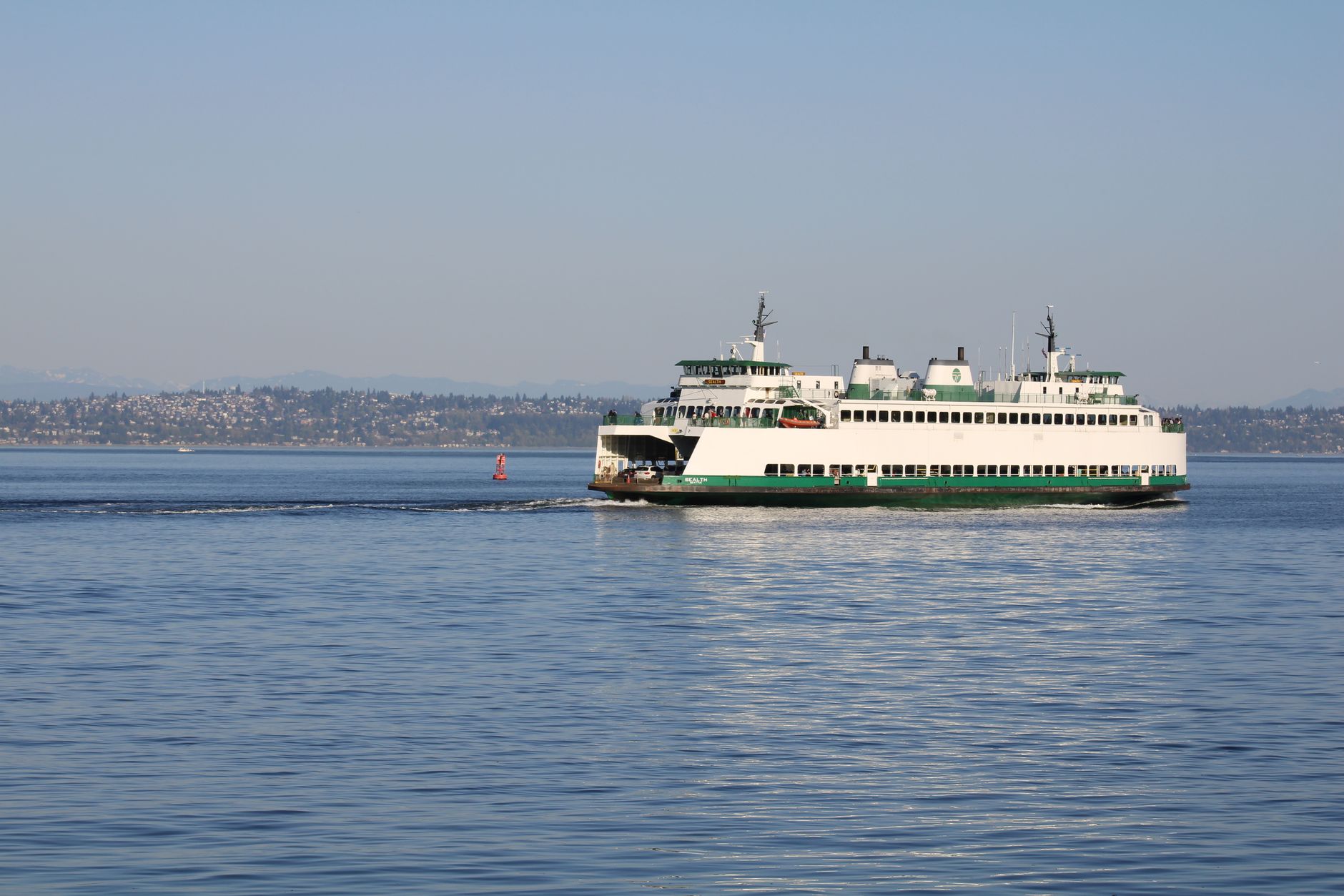 A Washington State ferry crossing calm Puget Sound &mdash; the on-the-water ride that doubles as transport toward the San Juan Islands