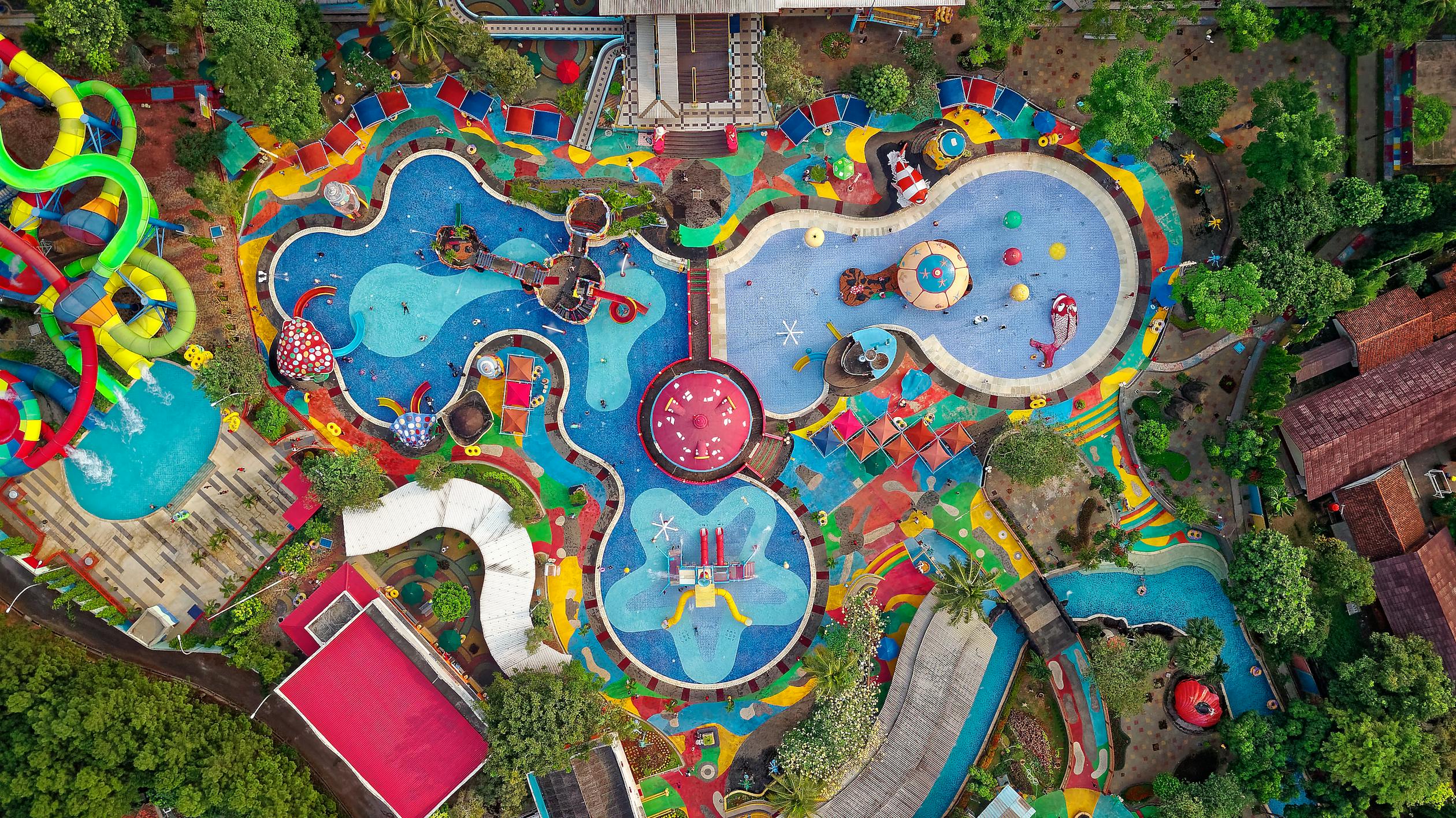 Aerial view of pool and water slide area showing the variety of aquatic activities available for families