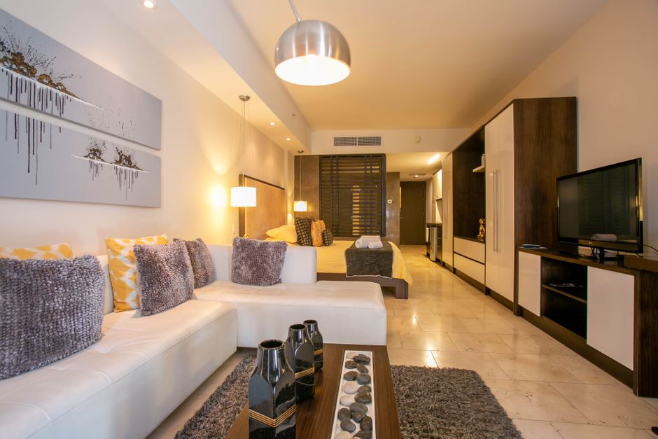 Spacious condo-style suite with a sofa and separate sitting area, the layout many St Thomas package resorts offer families