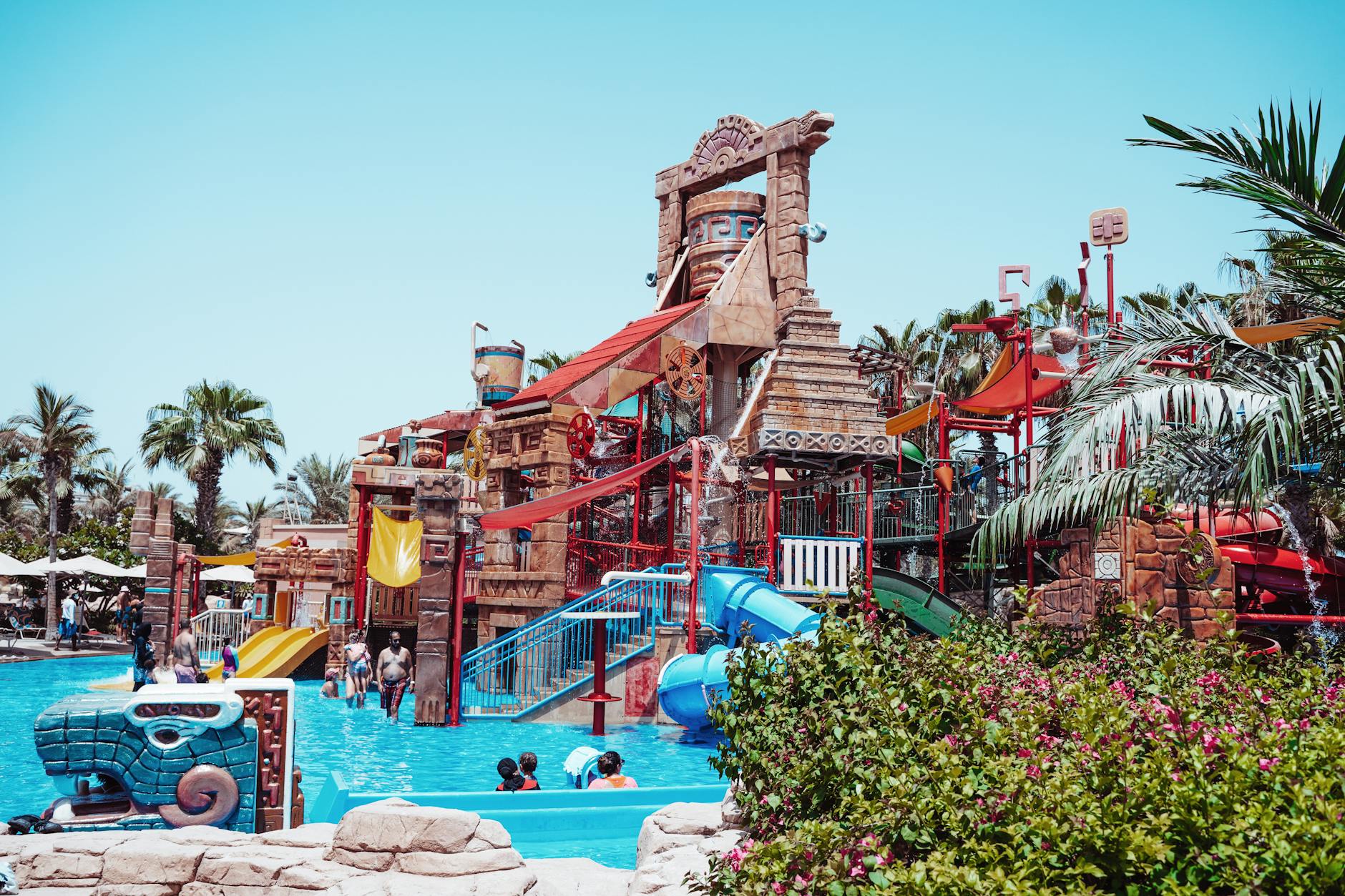 Colourful waterpark with slides and pools on a sunny day