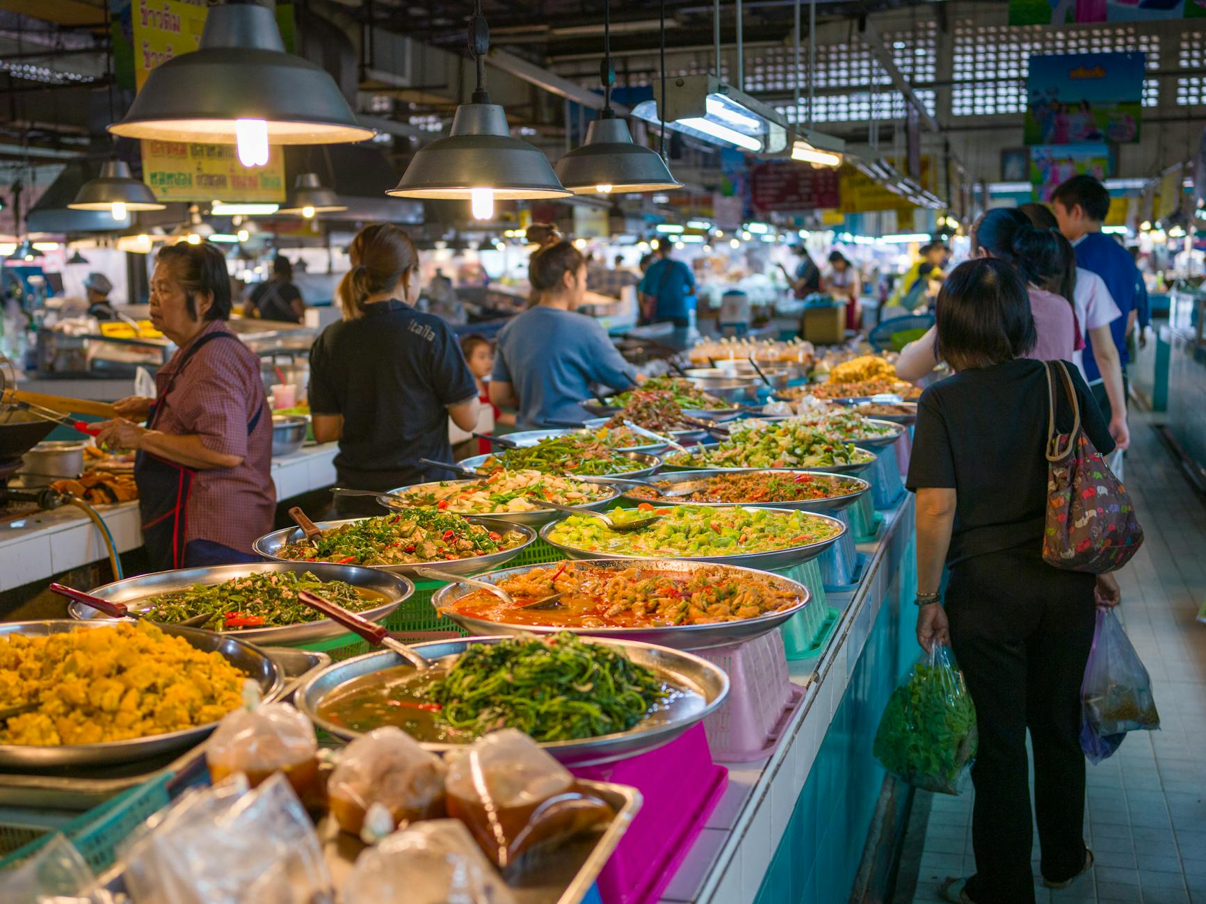 Colorful Bangkok street food market with Thai dishes and local vendors